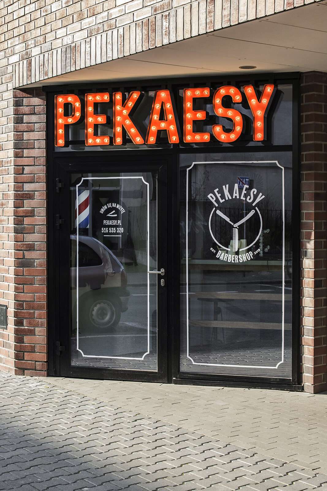 pekaesy hair salon barber shop - pekaesy-letters-with-lights-over-the-entry-to-barbera-letters-with-coloured-on-height-mounted-to-the-panel-on-the-window-with-company-logo-letters-spatial-3d-poznan